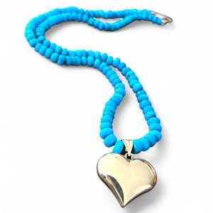 GOLD PUFFY HEART ON A TURQUOISE NECKLACE