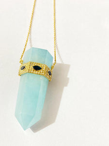 Aquamarine crystal pendant necklace with sapphire evil eye