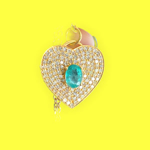Diamond heart necklace with an emerald on a gold chain